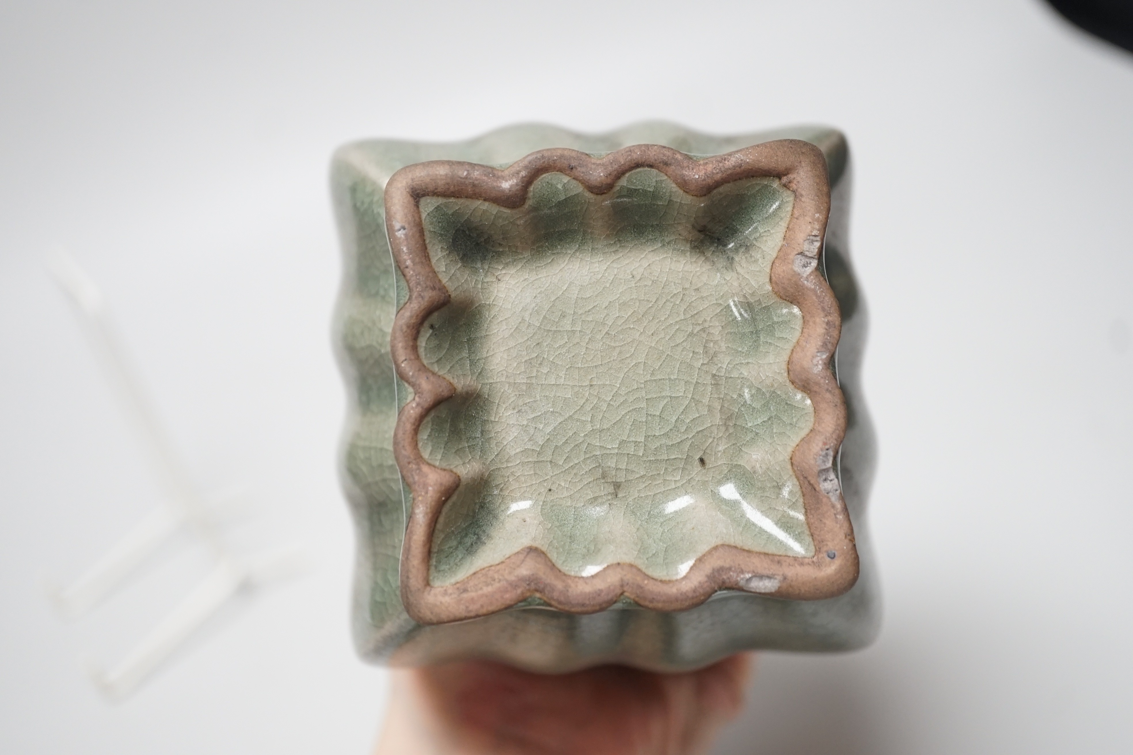 A Chinese blue and white ‘qilin’ dish, an octagonal bowl and a Korean celadon vase (3) largest 33cm diameter